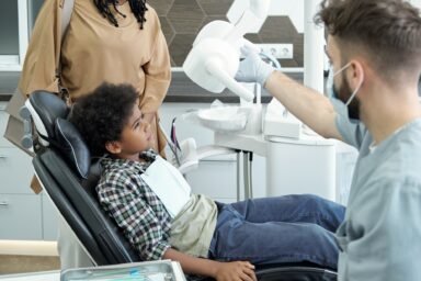 https://veeh.sterling-academy.com/wp-content/uploads/2025/06/little-african-boy-looking-at-medical-lamp-while-sitting-in-armchair-in-dental-office-e1750323660773.jpg